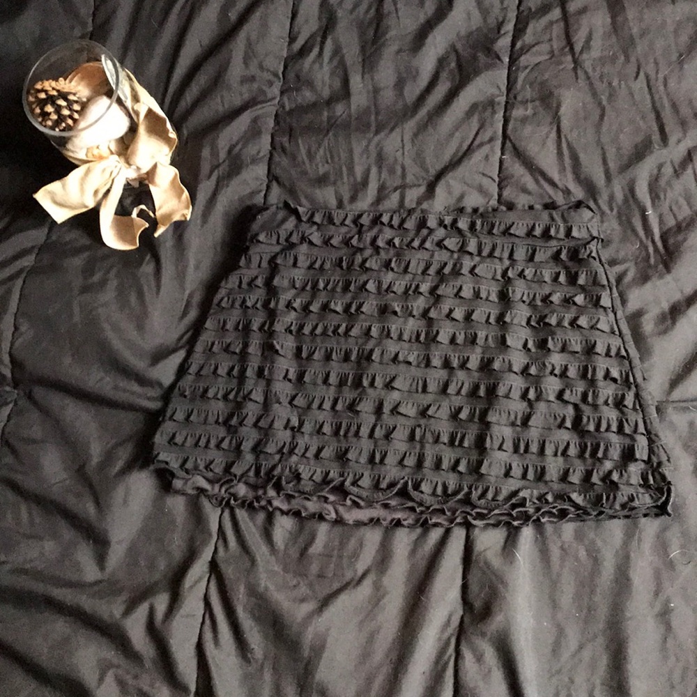 Black ruffled mini-skirt